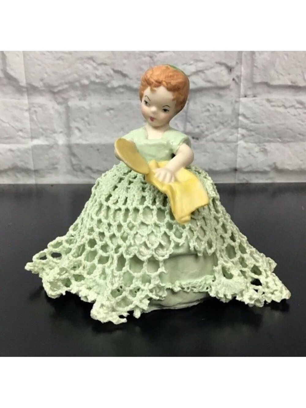 Vintage girl cleaning dishes Lace figurine